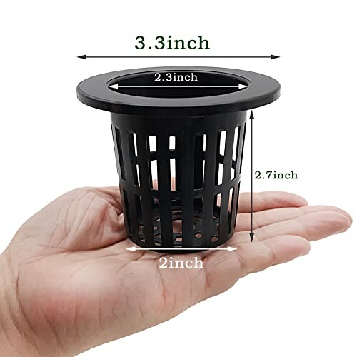 Hand holding a black net pot with dimensions labeled.